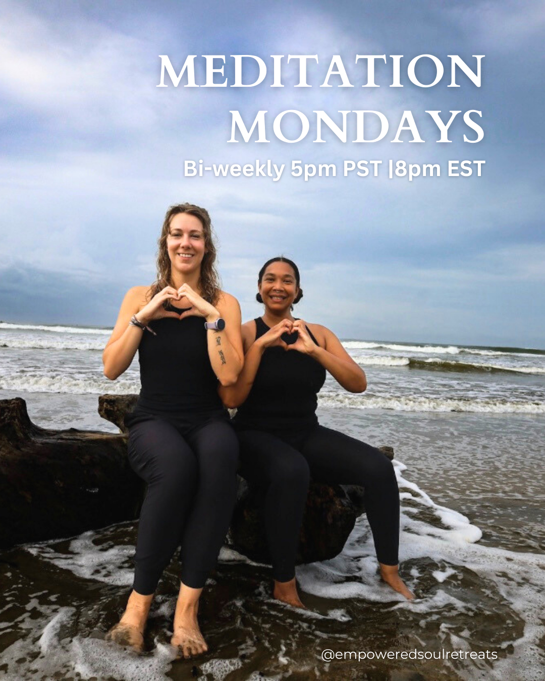 Two women sitting on a log at the beach making heart shapes with their hands, with waves and a cloudy sky in the background, promoting bi-weekly meditation Mondays at 5pm PST/8pm EST.