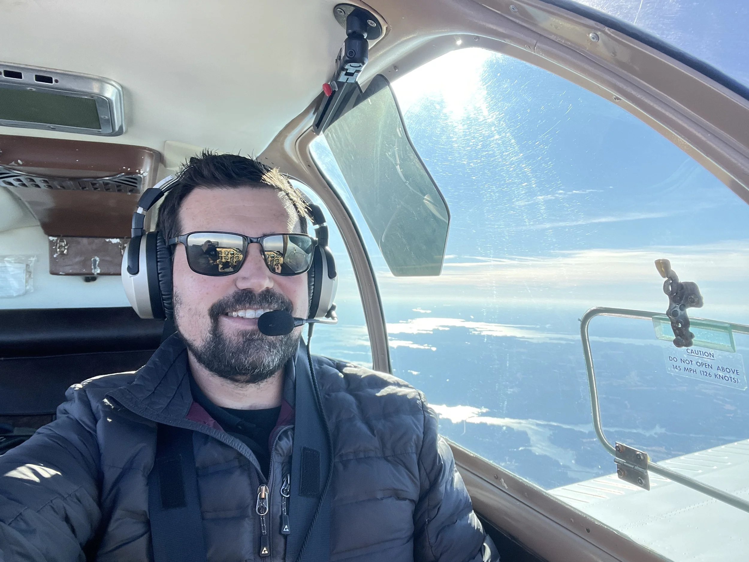 Eric Luzier, founder of Luzier Aviation, in the cockpit of his Beechcraft Bonanza