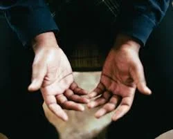 Person with hands cupped together