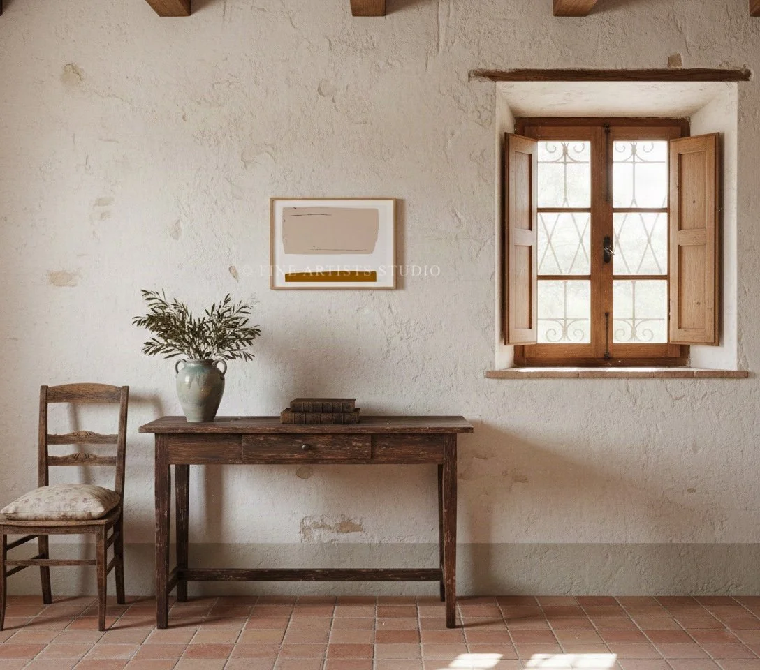 Straight-on view of a framed modern gradient art print displayed on a textured plaster wall above a rustic wooden bench with a ceramic vase.