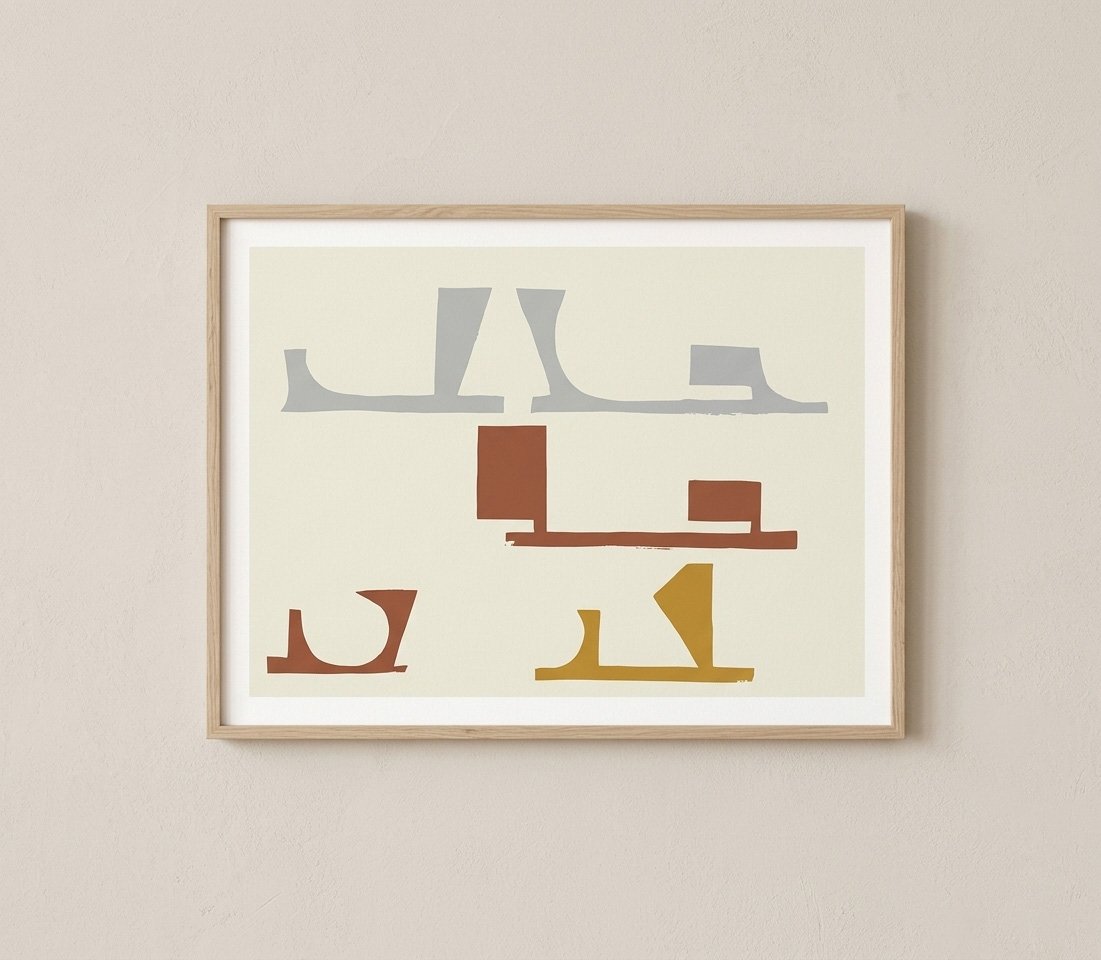 Close up of a framed abstract artwork with geometric shapes in gray and mustard yellow. Modern fine art print in a natural wood frame by Fine Artists Studio.