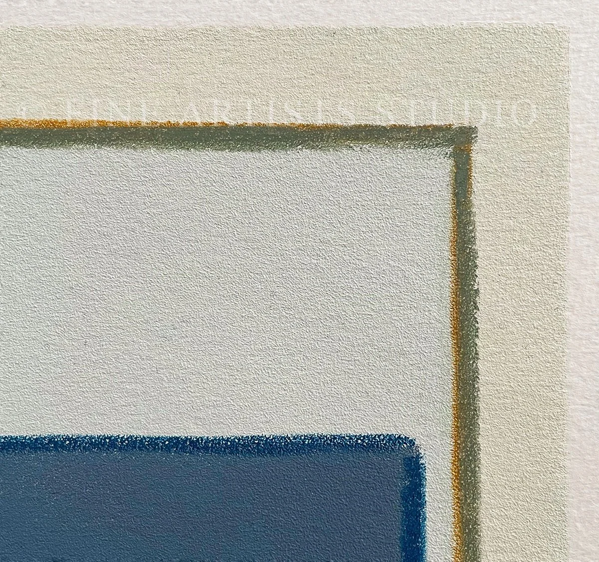 Minimalist handmade artwork titled "Traces Green" by Aggeliki Dimitriadou, featuring a solid blue color block and a fine green line painted with oil pastels using a hand-cut stencil, macro details.