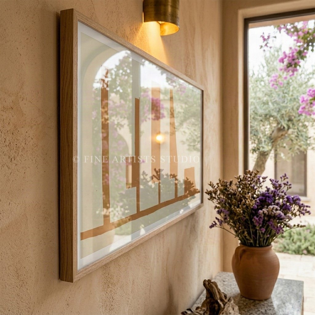 Angled shot of a framed modern abstract print displayed in a sunlit Scandinavian style dining space with minimalist table settings.