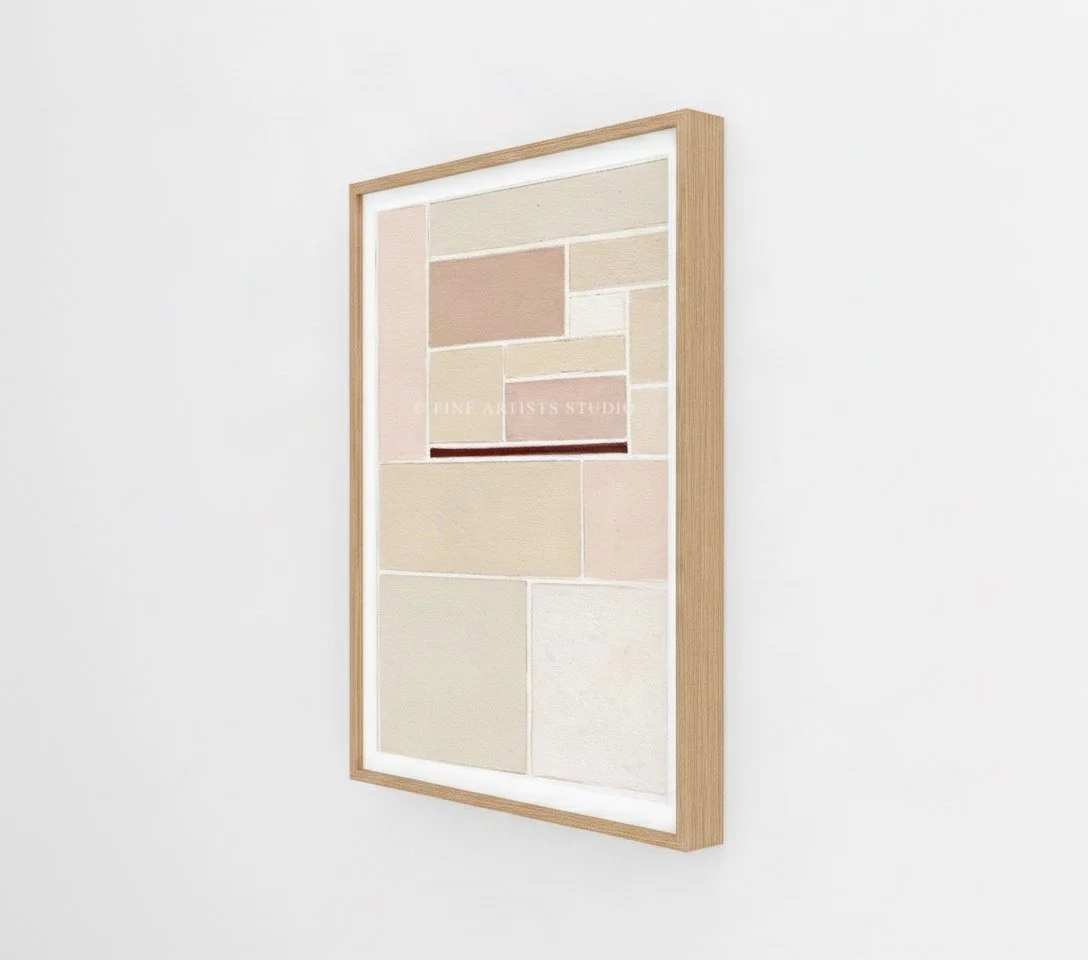 Angled side view of the framed geometric print Schema II by Aggeliki Dimitriadou, highlighting the profile of the light oak wooden frame against a seamless white studio wall.