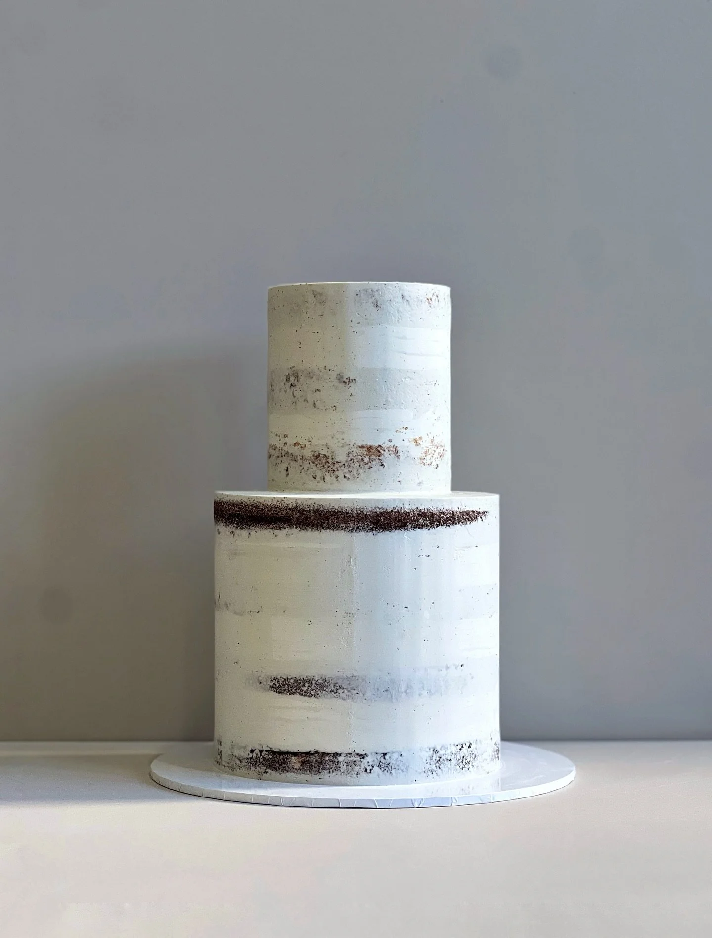 Soft, simple, and full of charm.
Our two-tier semi-naked cake brings that &ldquo;just enough&rdquo; elegance to your celebration. 

Planning a celebration? Send us a message.

Based in Cronulla, Sydney.