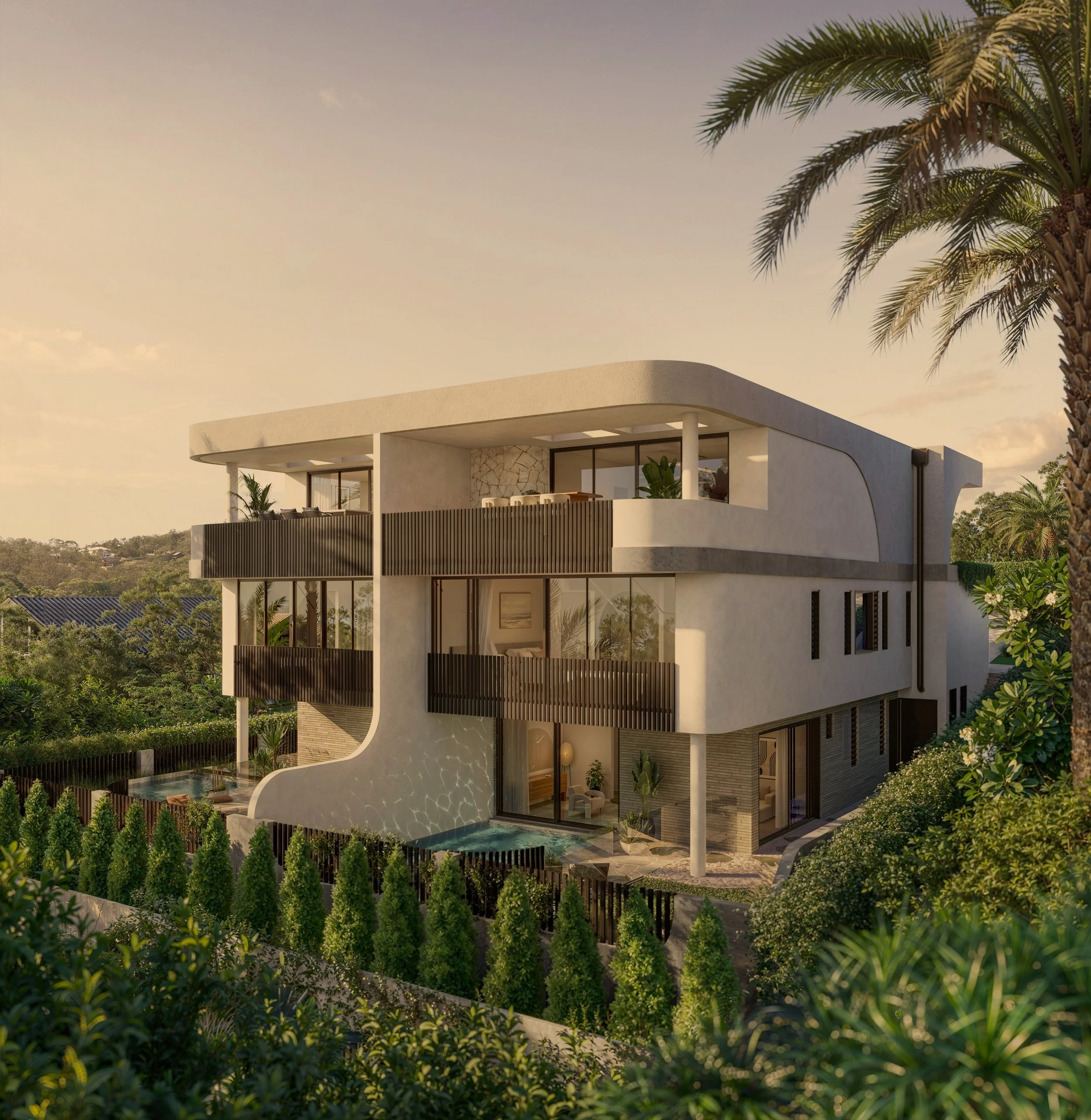 Modern white house with curved edges and large windows, surrounded by lush green trees and palm trees, under a clear sky with a warm glow.