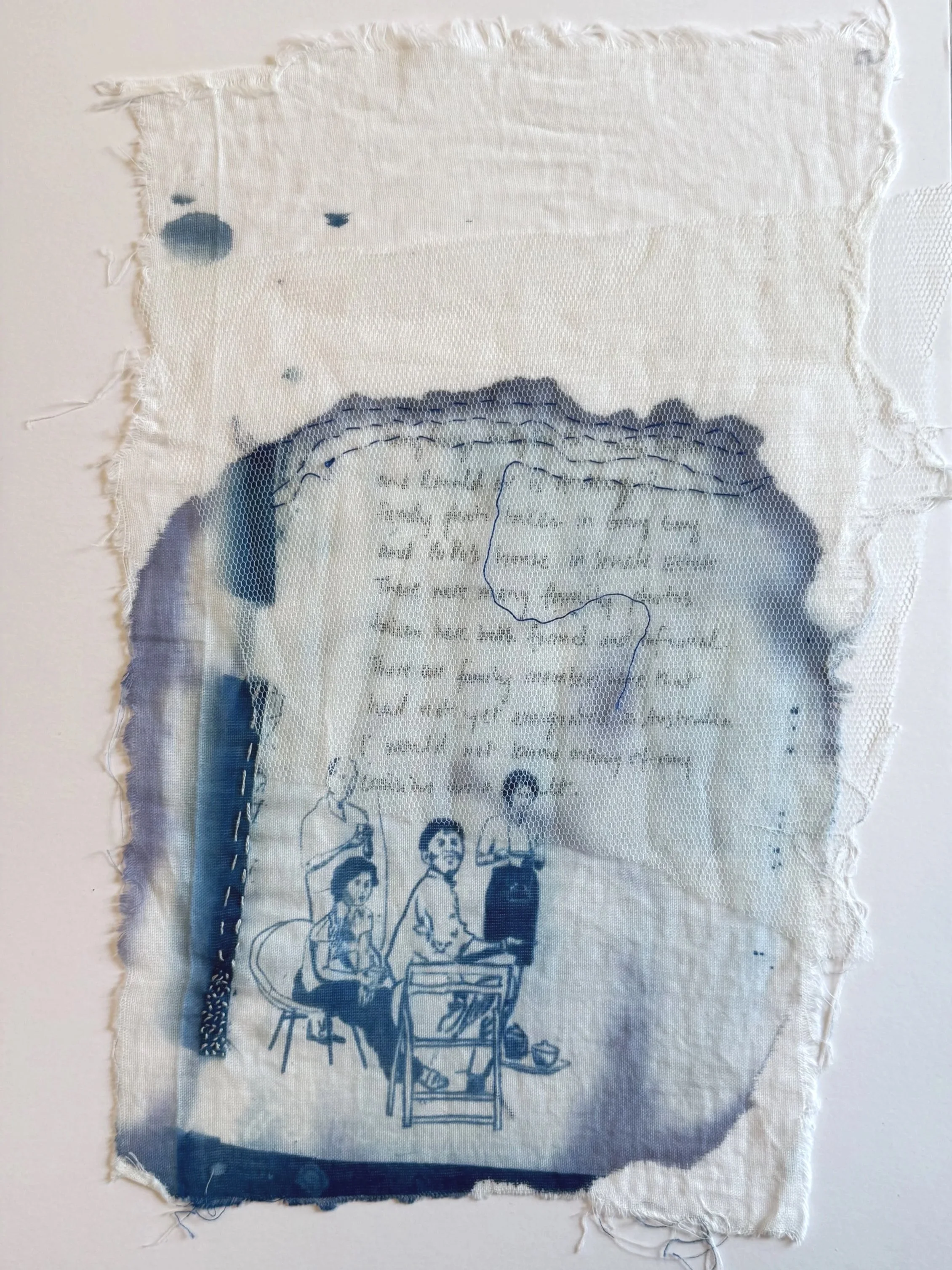 A torn fabric piece with a cyanotype printed illustration of four people, two seated on chairs and two standing, overlaid with handwritten text and some fabric patches.
