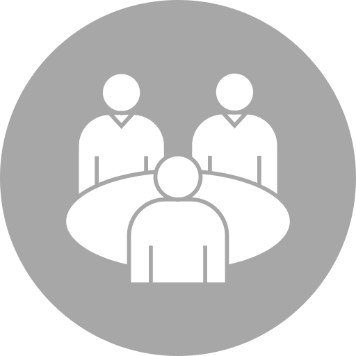 Icon of three people sitting at a round table, representing a meeting or discussion.