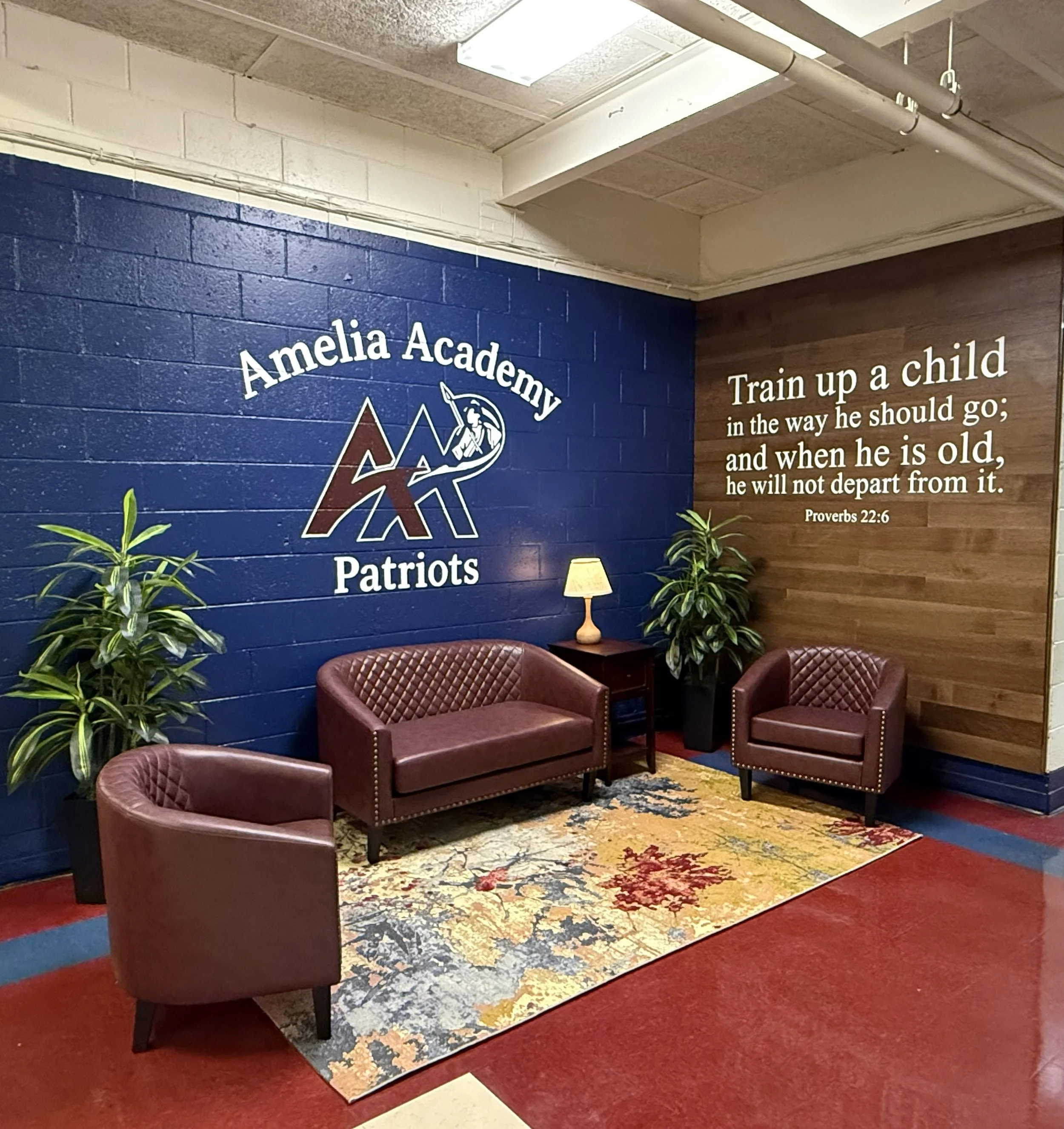 Custom interior wall graphics and lettering by Outpost Signs for Amelia Academy in Amelia, Virginia, creating a welcoming space that reflects school pride and faith.