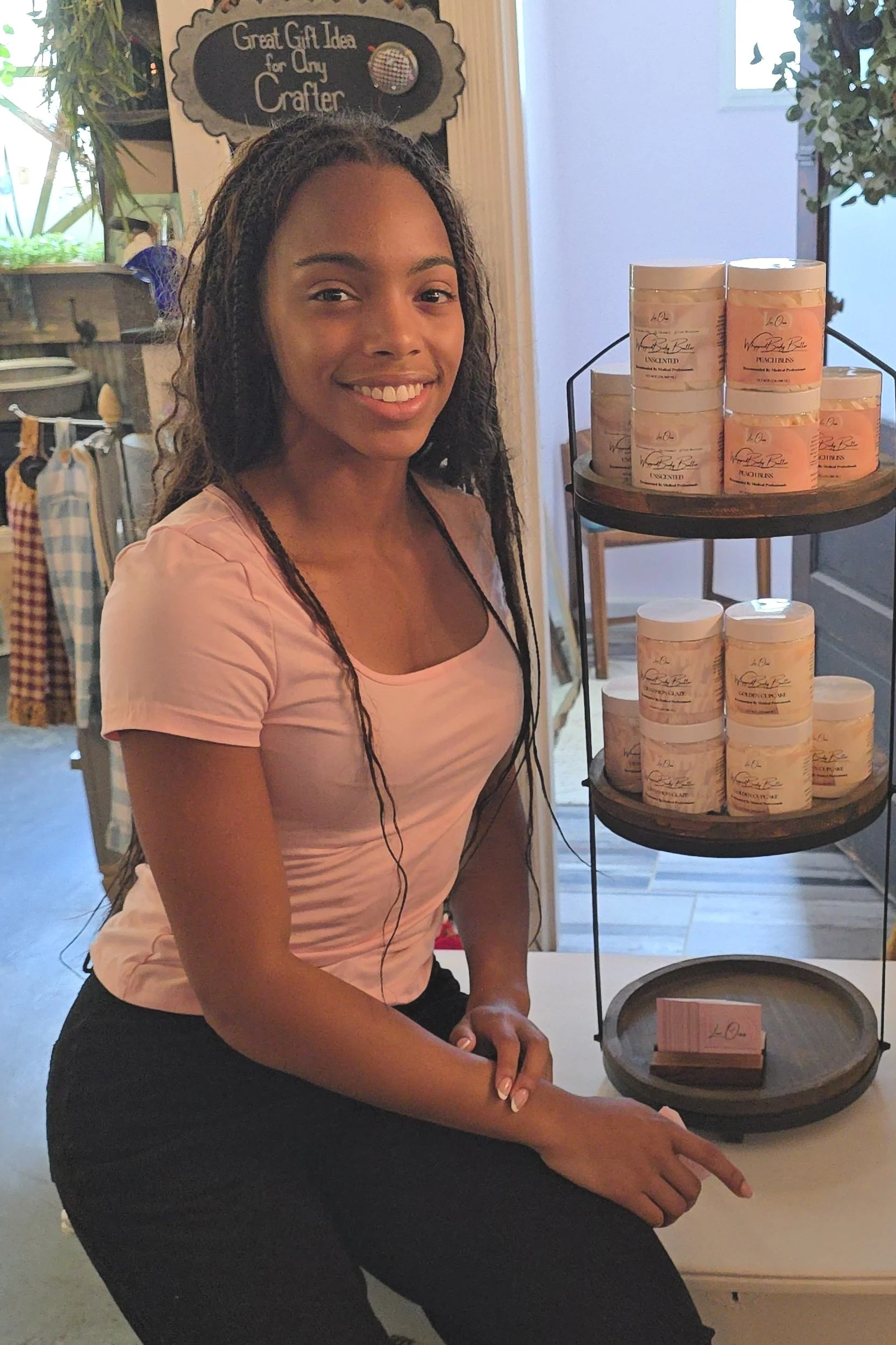 Zaria Parker with the Lux Oasis display at The Rustic Awning Boutique signifying new partnership