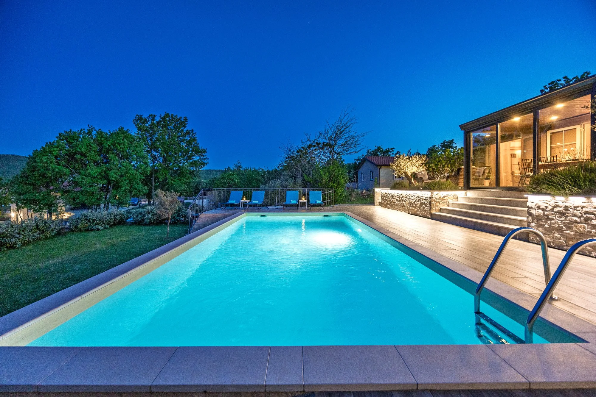 Private pool illuminated at night in a luxury villa in Istria