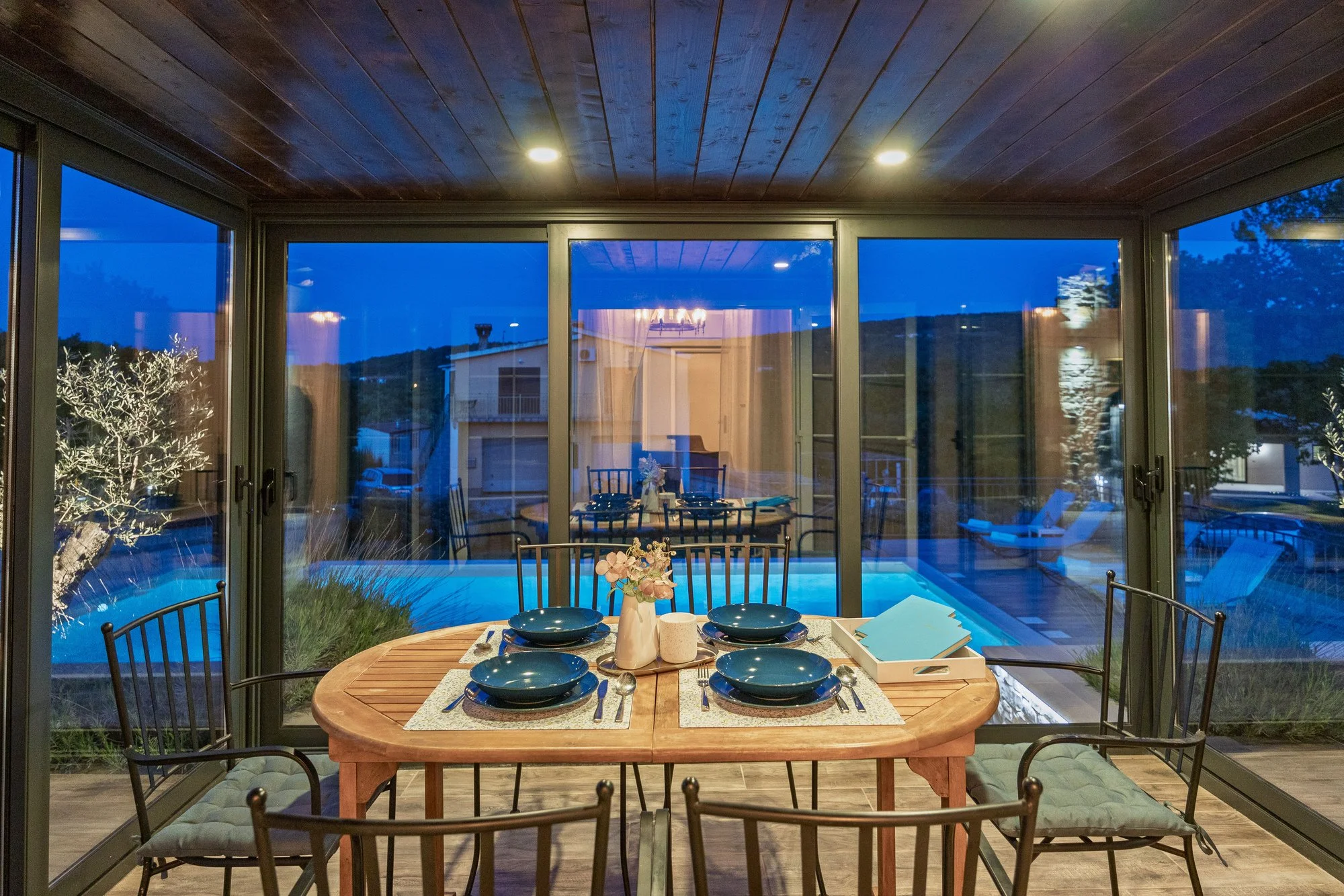 Evening atmosphere at thedining area wit pool view in a private villa in Istria