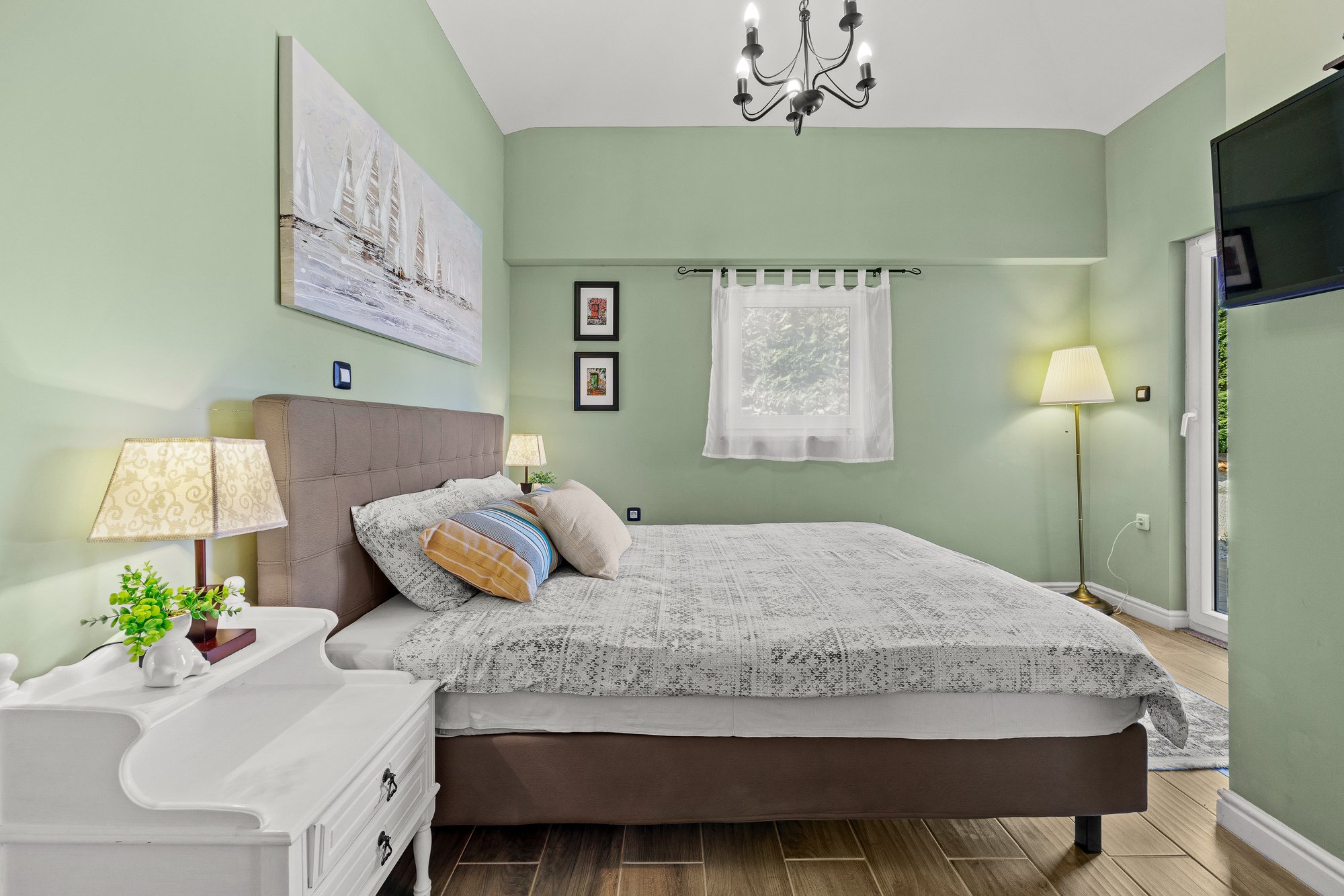 Bright and stylish bedroom in a luxury holiday home in Istria