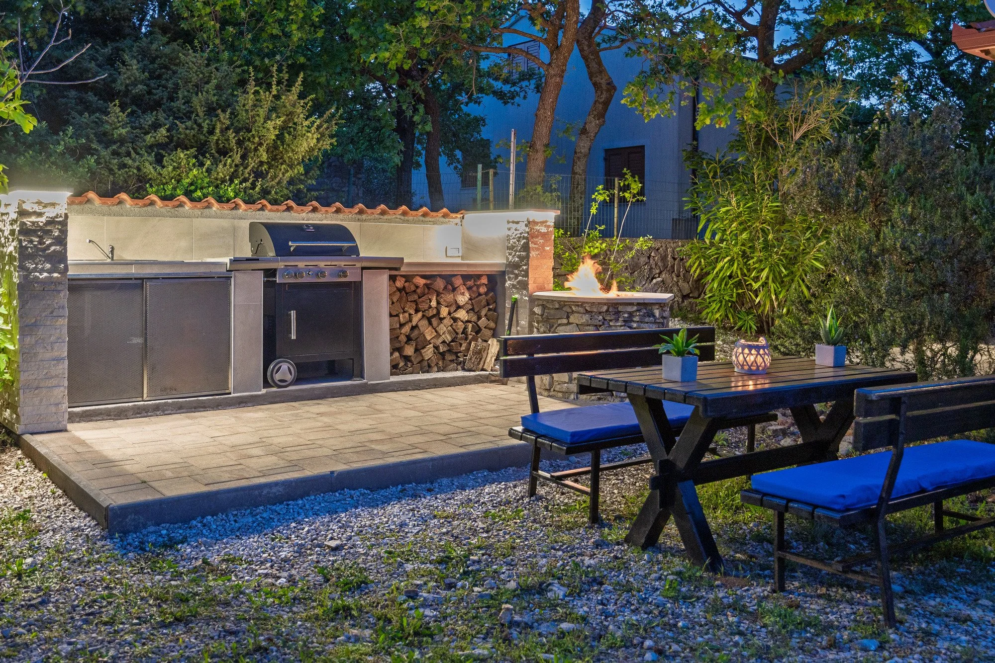 Outdoor barbecue area at night in a luxury villa in Istria