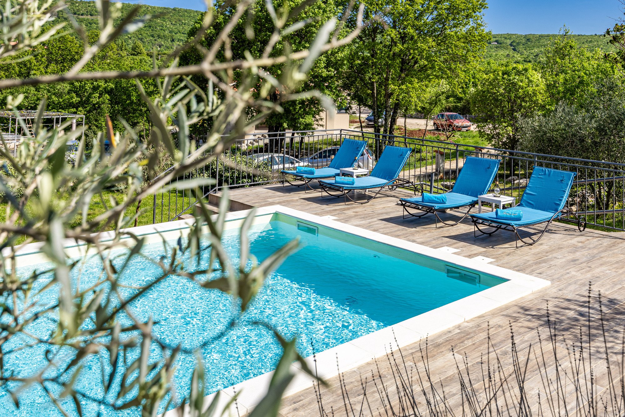 Swimming pool with sun loungers in a holiday villa