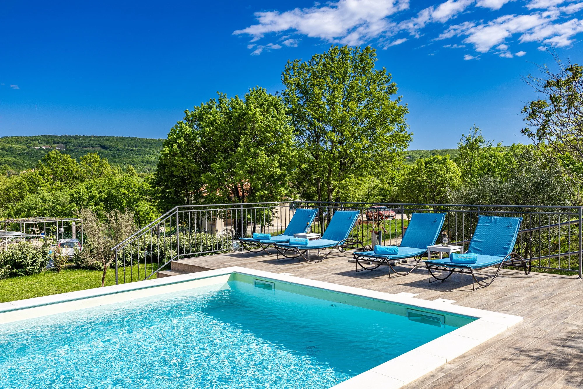 Poolside relaxation area with sun loungers in Istria
