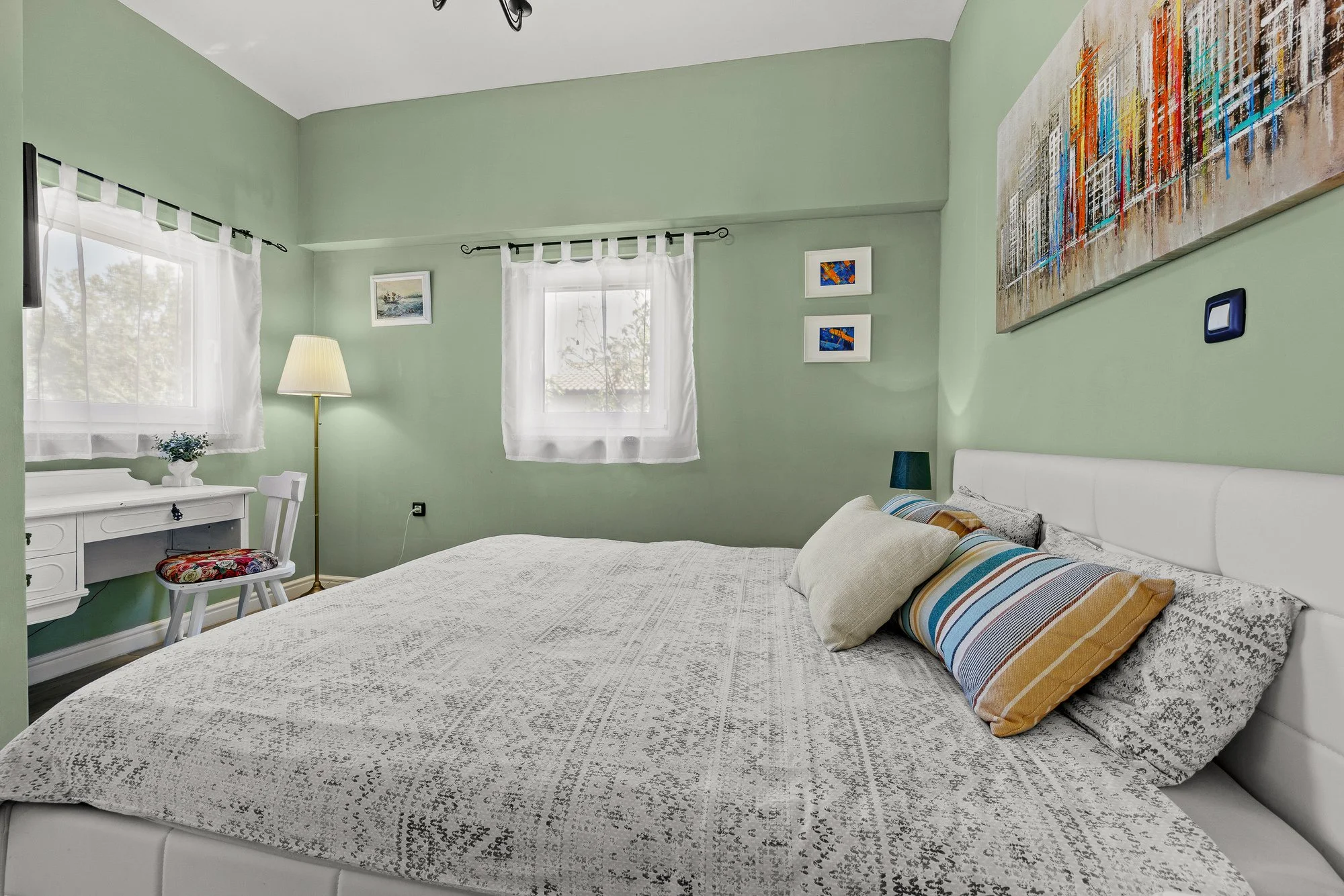 Bright and stylish bedroom in a luxury holiday home in Istria