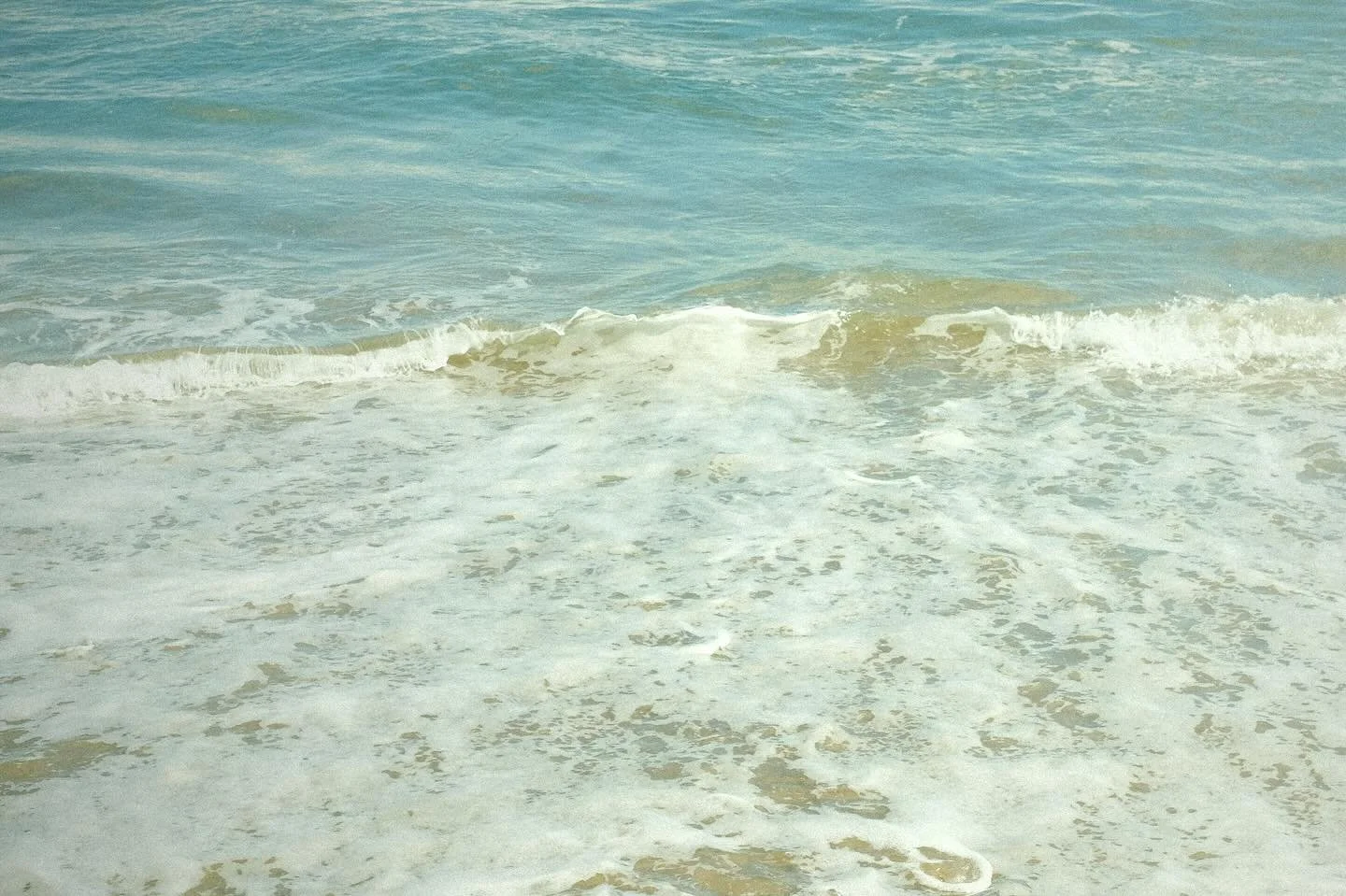 Gentle waves
bubbles shining
bleached by the sun
Soft and cool
I go to her