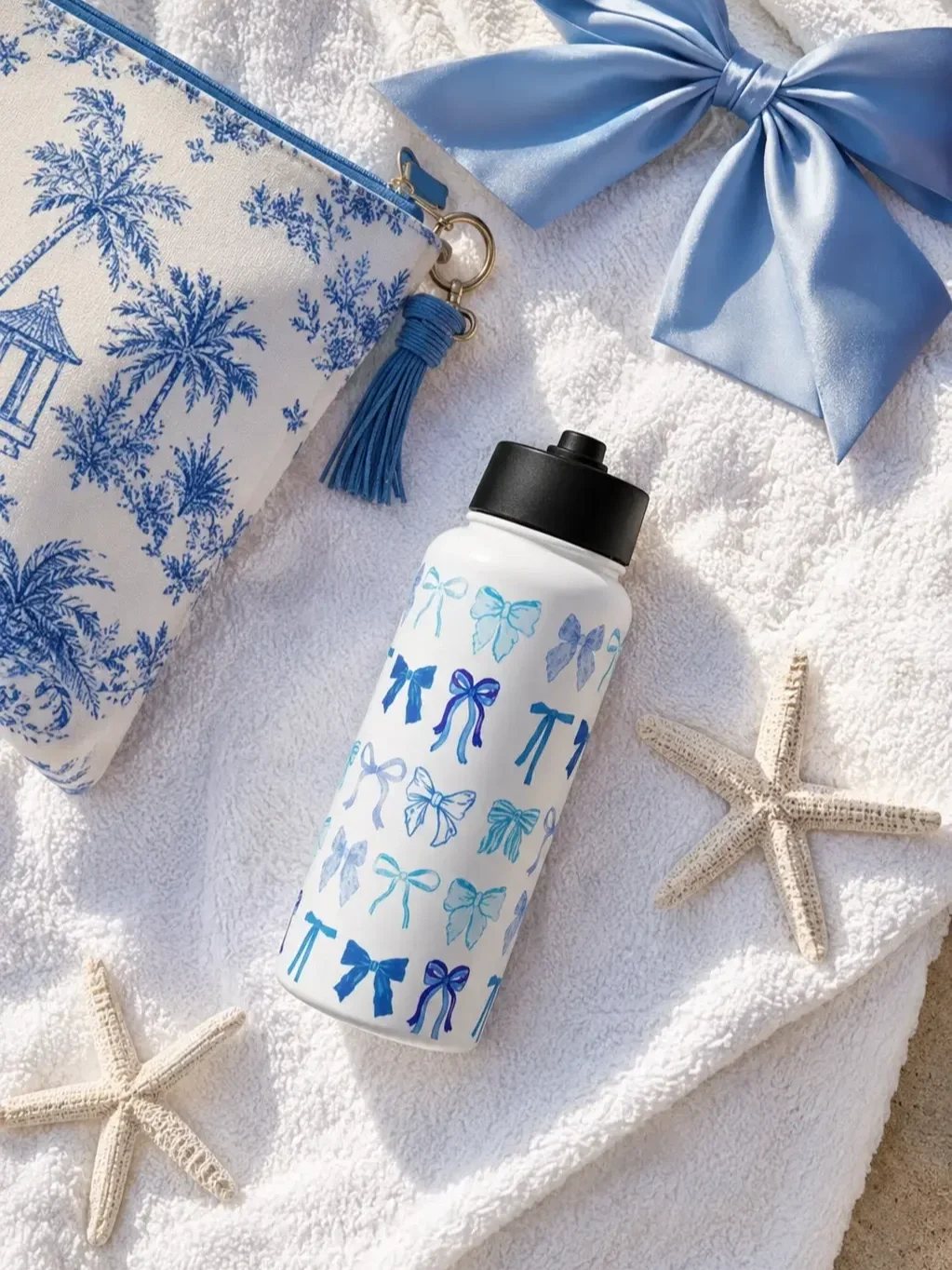blue-coquette-bows-insulated-water-bottle-beach-style.webp