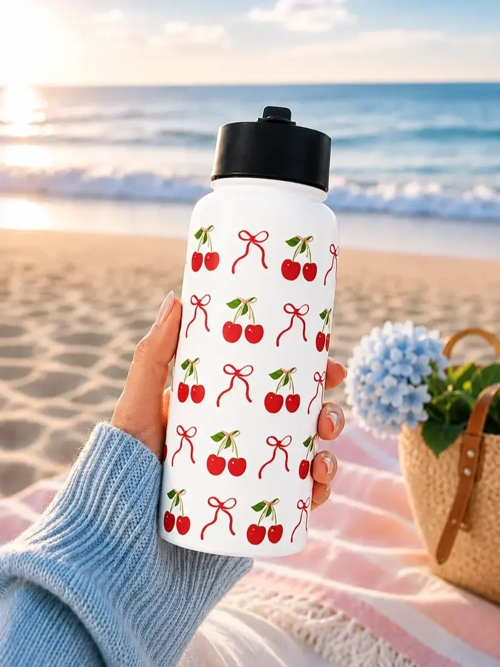 cherry-bow-insulated-water-bottle-beachfront-lifestyle.webp