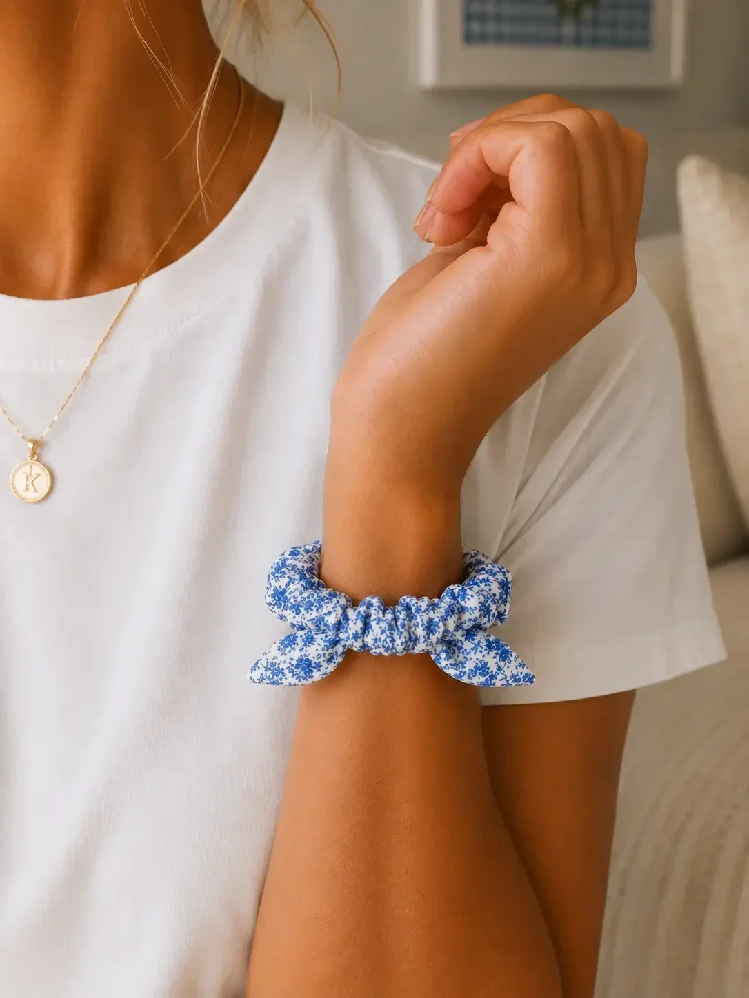 preppy-girl-light-blue-floral-scrunchie-wrist-closeup.webp