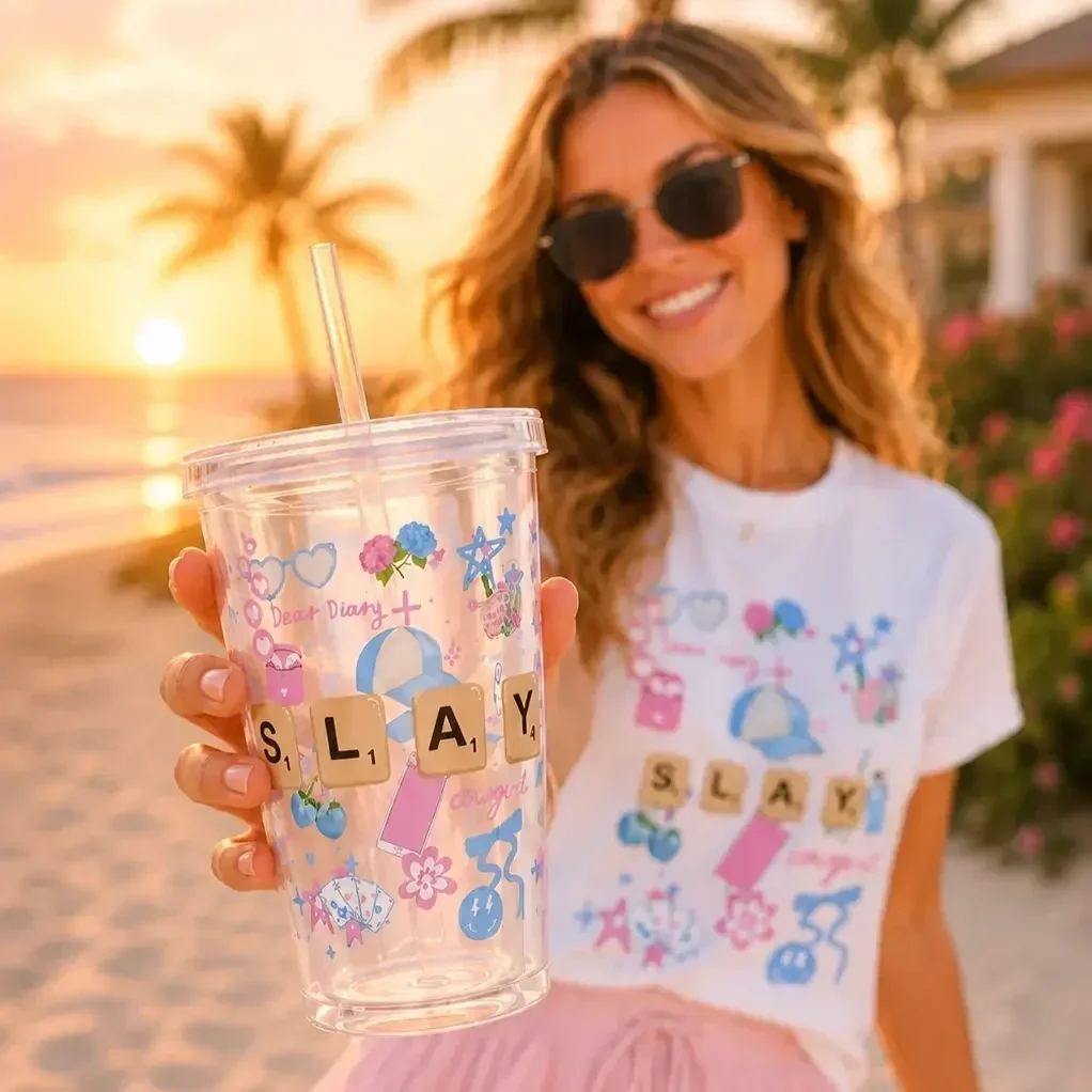 preppy-slay-doodle-graphic-tshirt-pink-ruffle-skirt-beach-outfit.webp