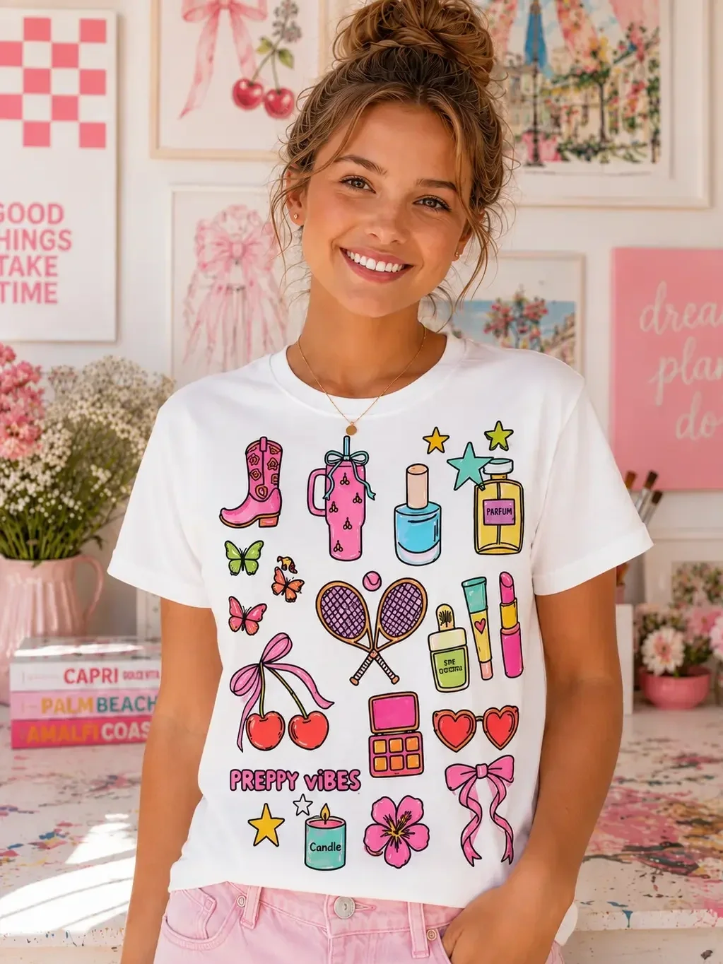 A smiling young woman wearing a white preppy vibes colorable graphic t-shirt fully colored in with bright markers.