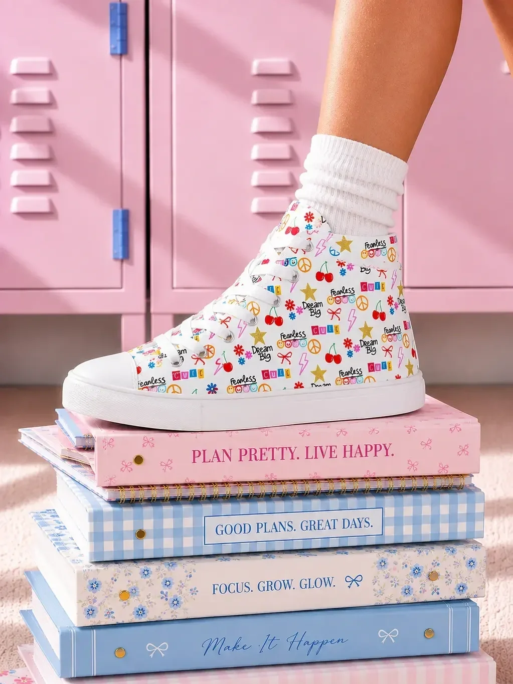 graphic-pattern-canvas-sneakers-stacked-notebooks-view.webp