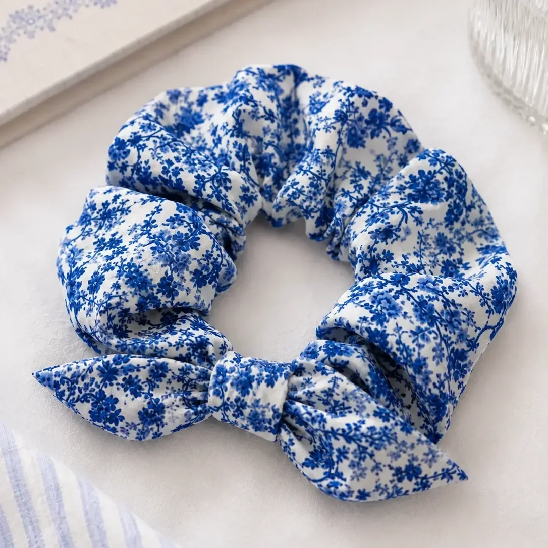 preppy-girl-light-blue-floral-scrunchie-product-closeup.webp