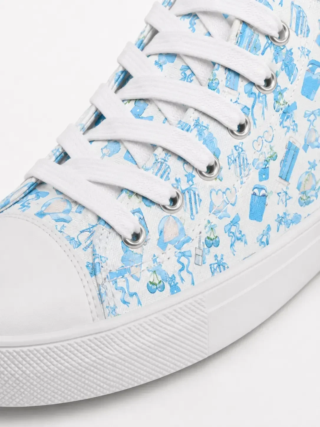 blue-coastal-charm-canvas-sneaker-close-up-view.webp