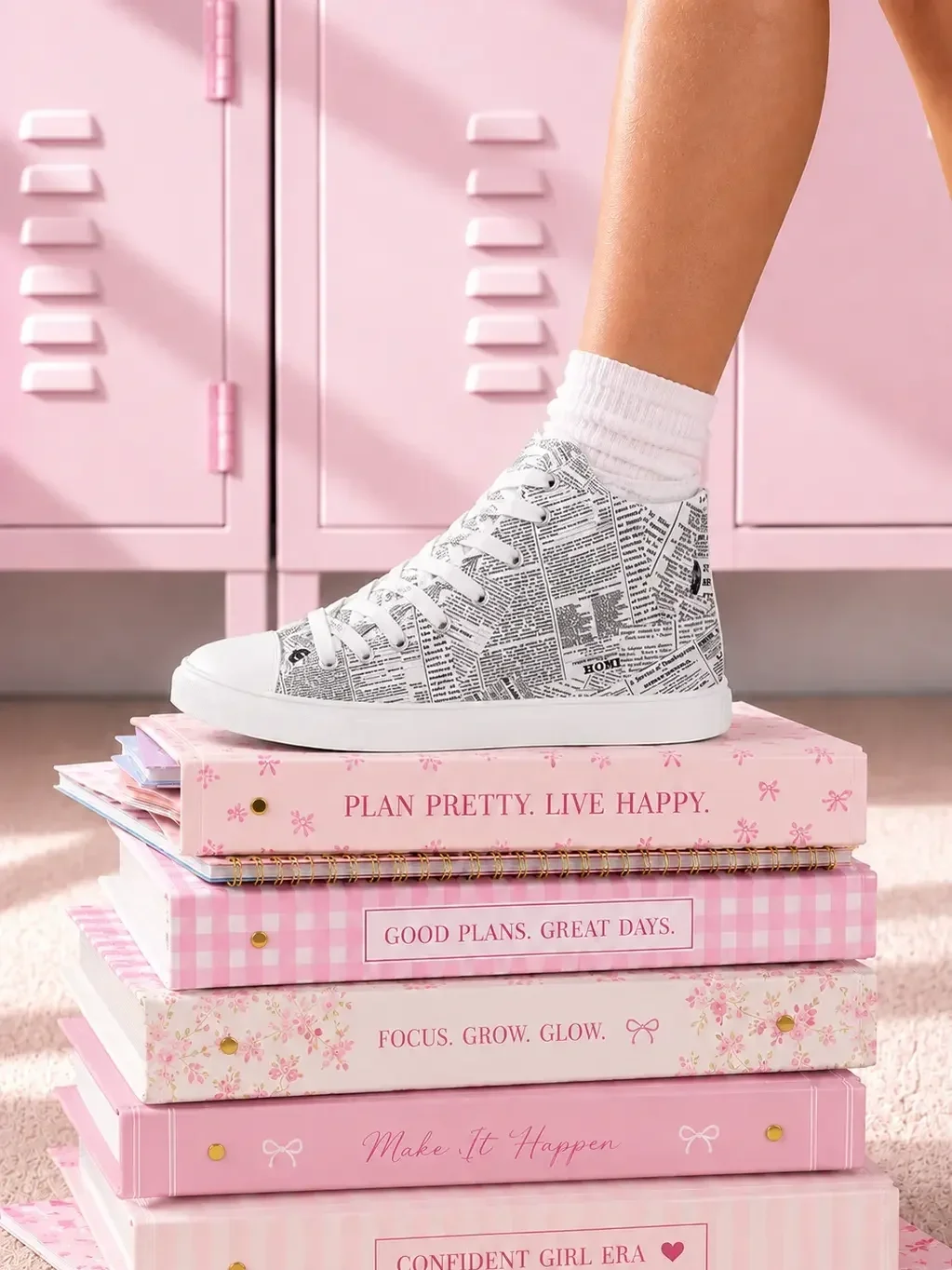 newspaper-print-canvas-sneakers-stacked-notebooks-view.webp