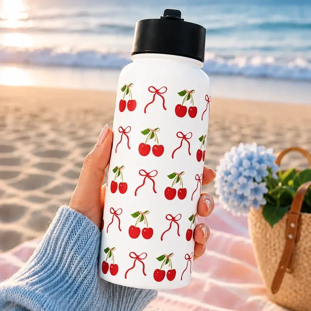 cherry-bow-insulated-water-bottle-beachfront-lifestyle.webp