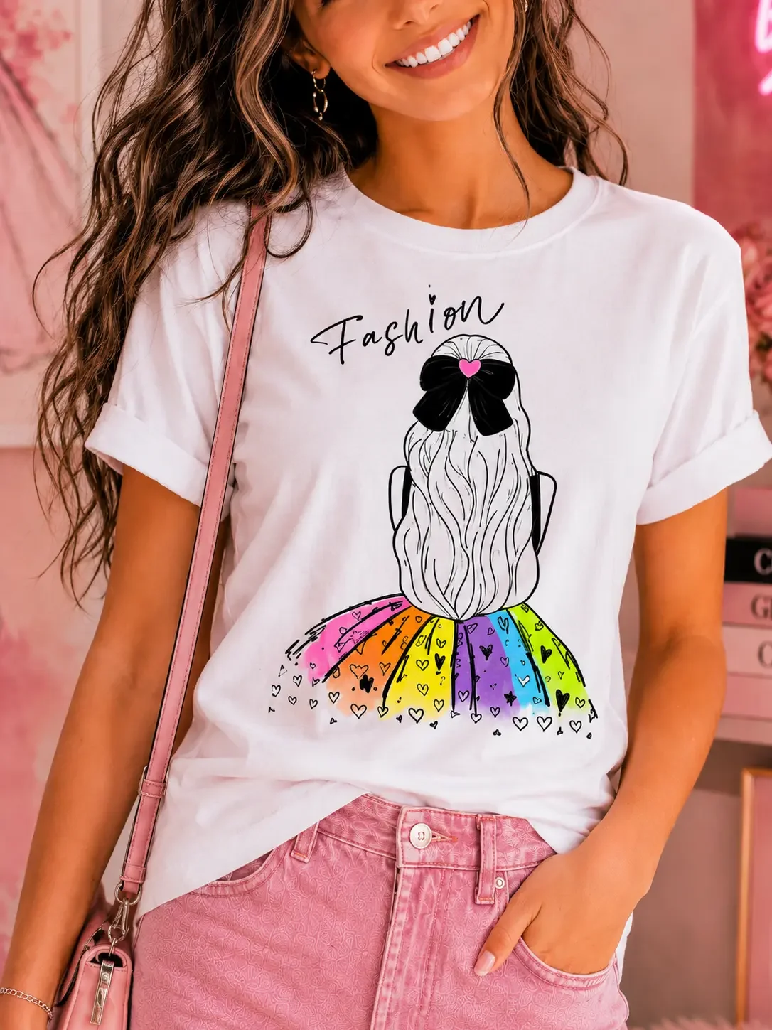 Detailed close-up of a white graphic tee featuring a colored fashion girl sketch design with a rainbow heart skirt.