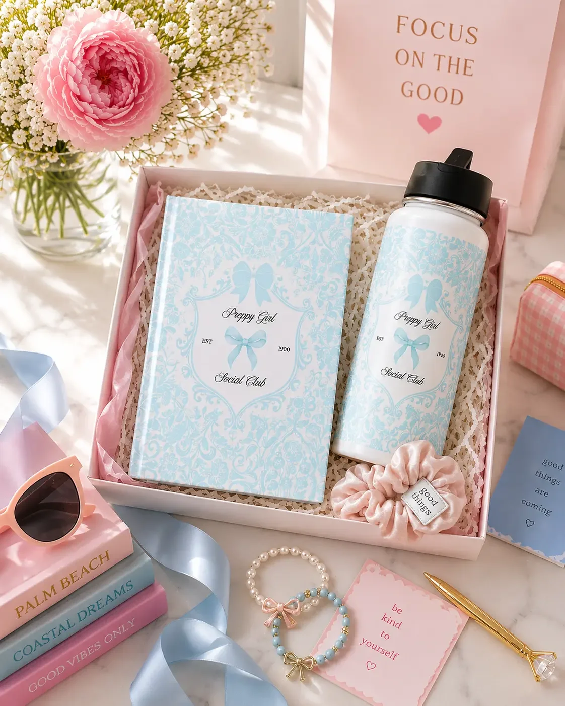 Preppy blue gift box set with a matching "Preppy Girl Social Club" damask journal, water bottle, scrunchie, and chic pink desk accessories.
