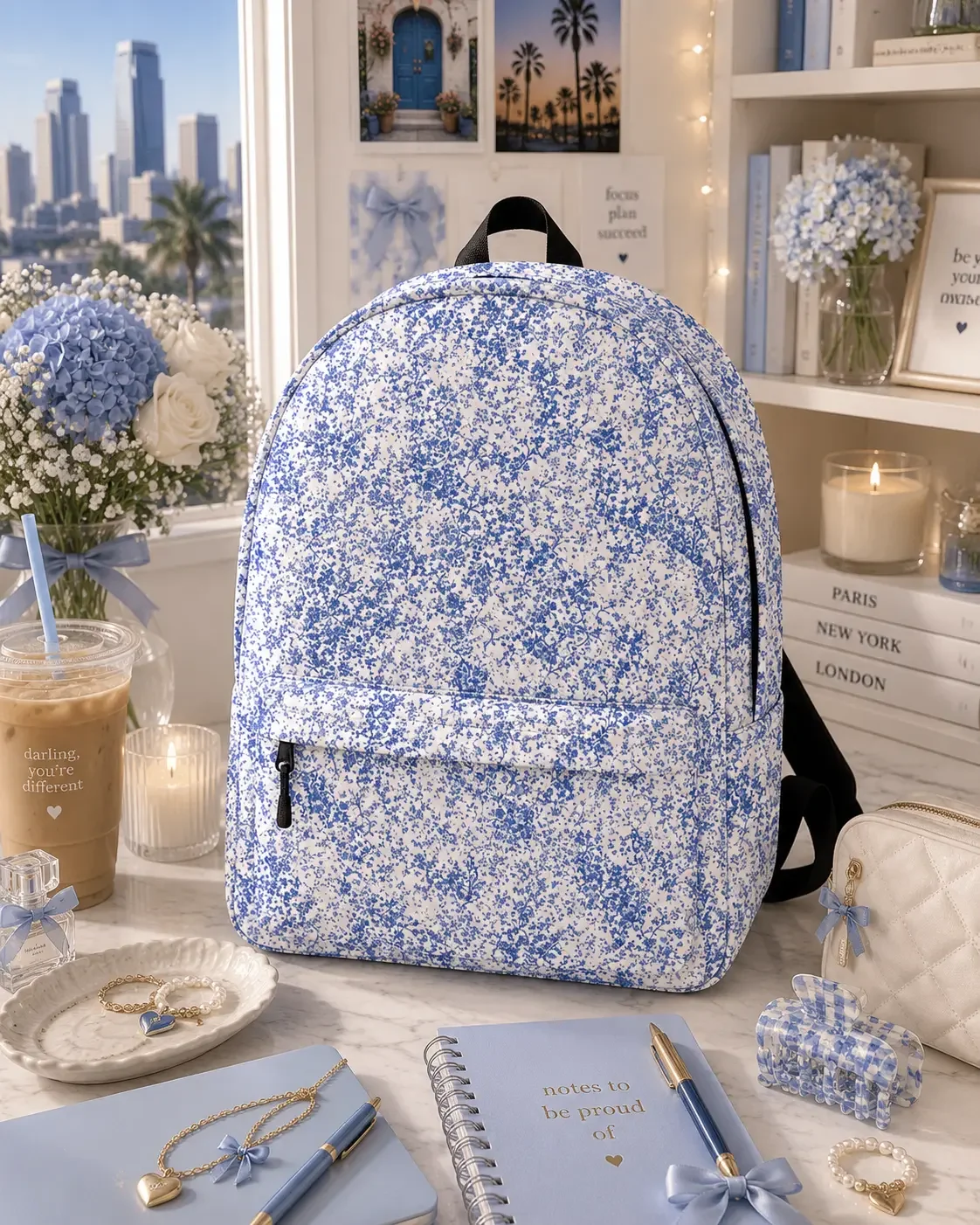 blue-floral-backpack-aesthetic-coastal-desk-setup.webp