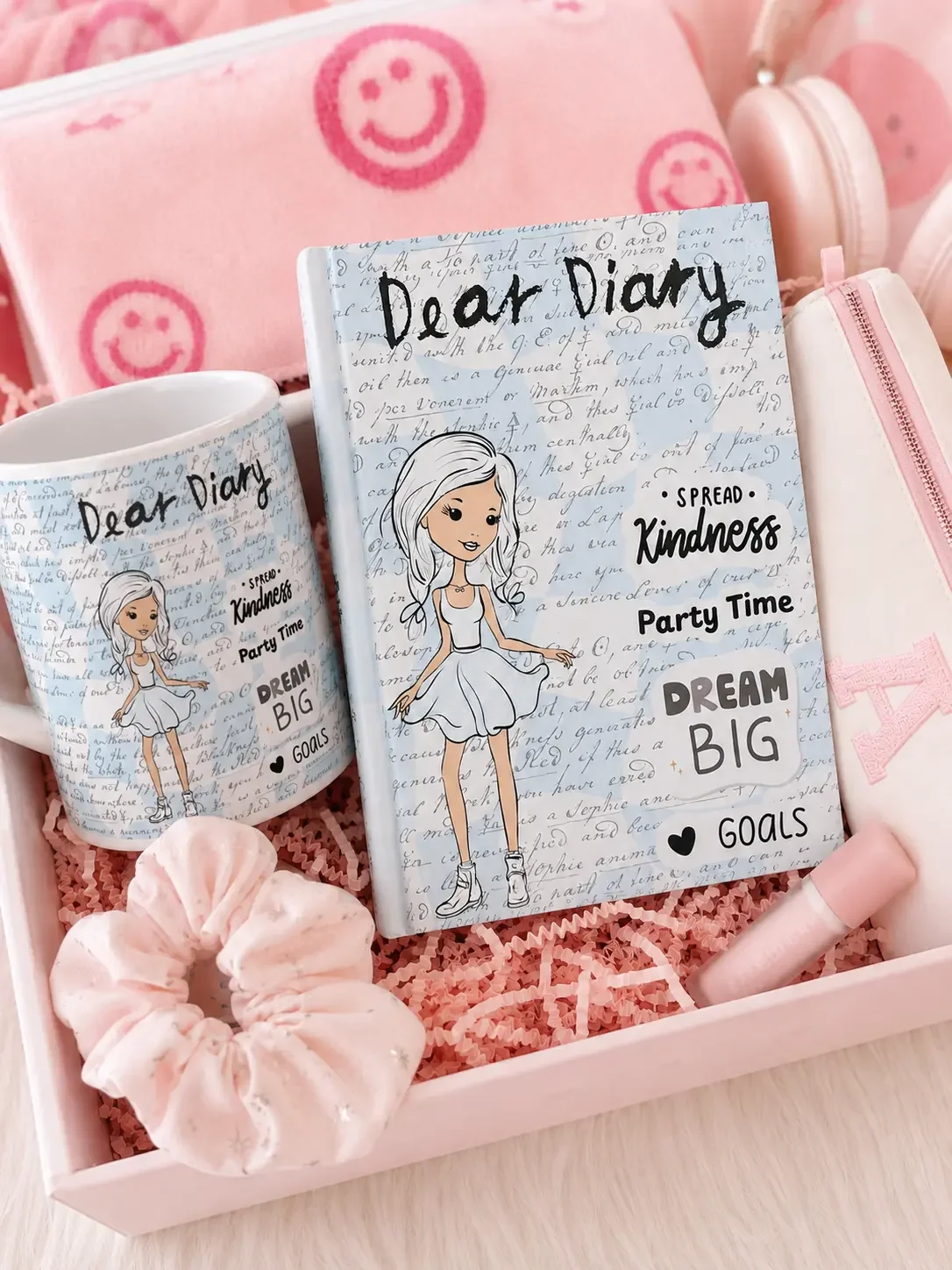 Preppy light blue gift box filled with a matching Dear Diary journal, ceramic mug, pink scrunchie, pencil case, and lip balm.