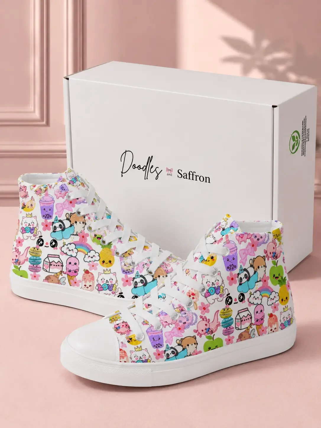 Pair of white high-top canvas sneakers with a colorful cartoon character pattern standing in front of a white shipping box.