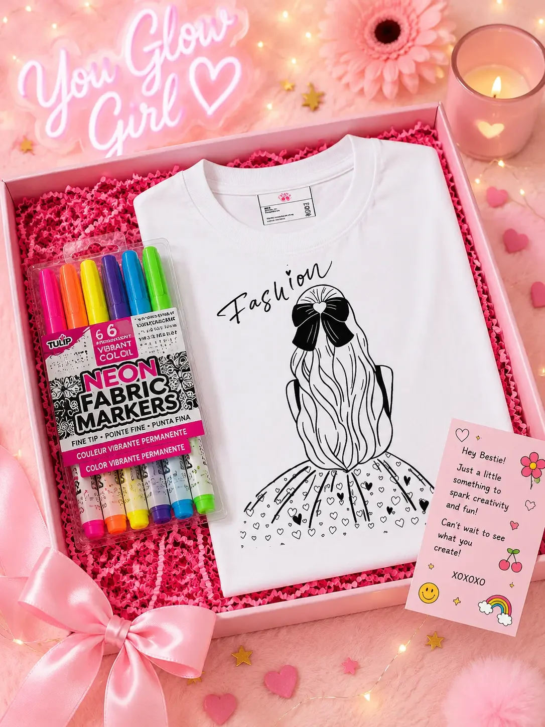 Open pink gift box featuring a white fashion sketch coloring shirt, Tulip fabric markers, and a bestie gift card.