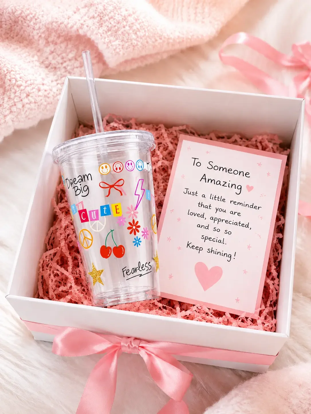A colorful preppy Y2K doodle tumbler packed inside a white gift box with pink shredded paper and an encouraging note card.