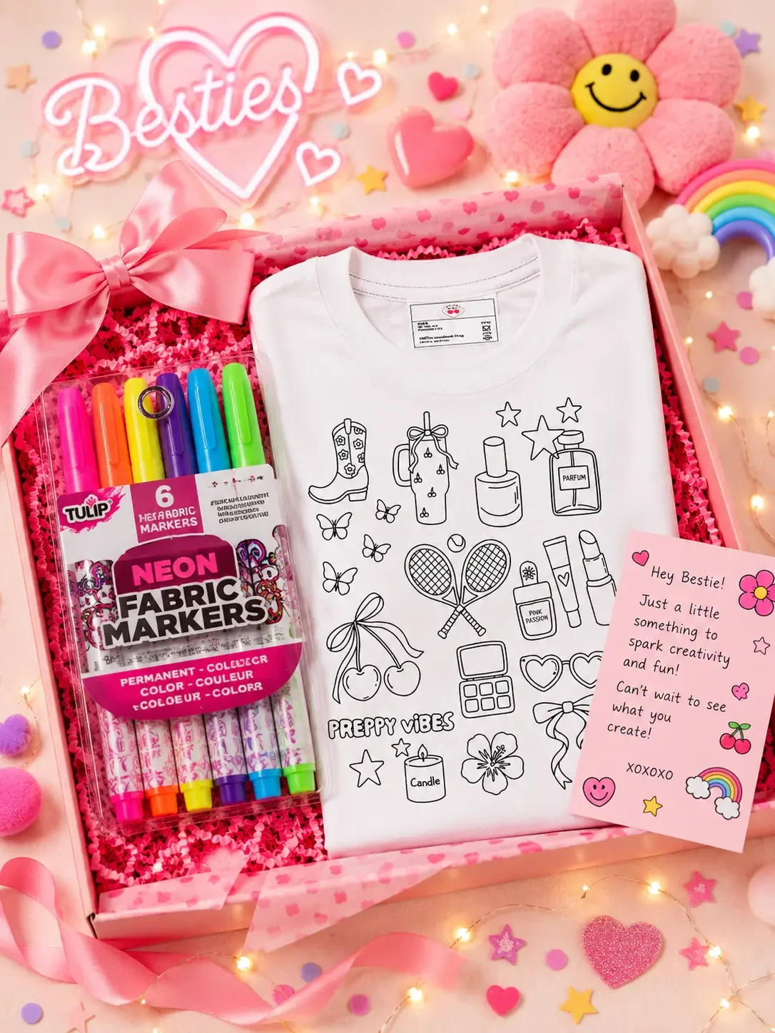 Open bestie gift box containing a white preppy vibes colorable graphic tee, a pack of neon fabric markers, and a note card.