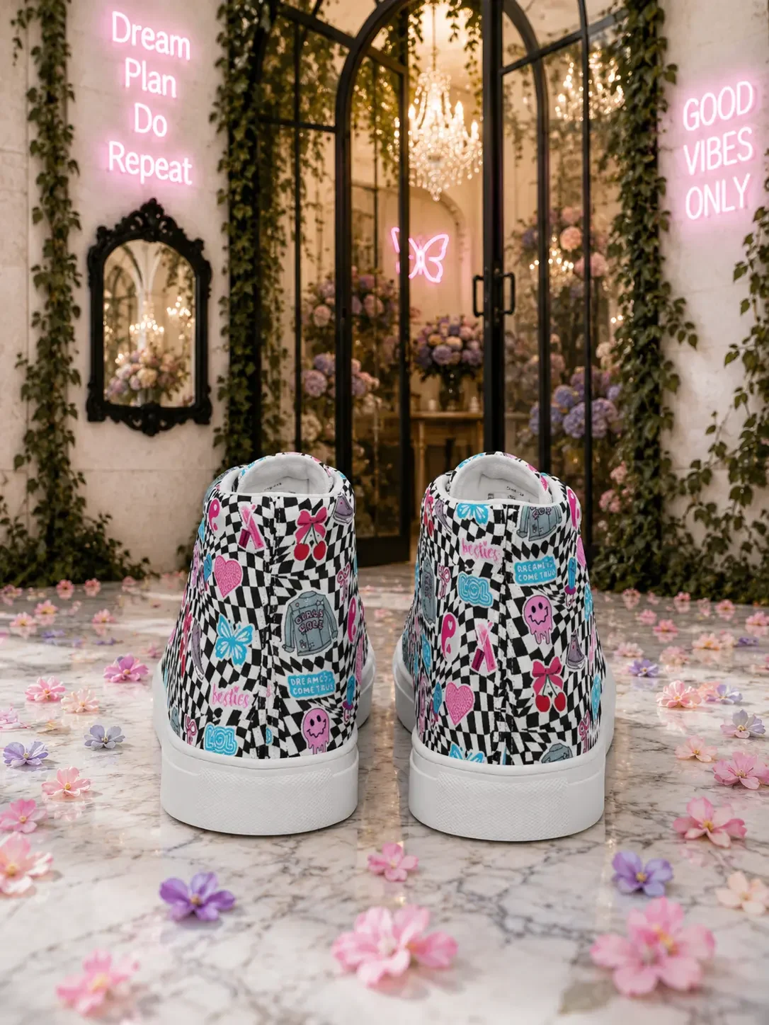 Back heel angle view of black and white checkered high-top canvas sneakers with colorful graphic doodles on a marble floor.
