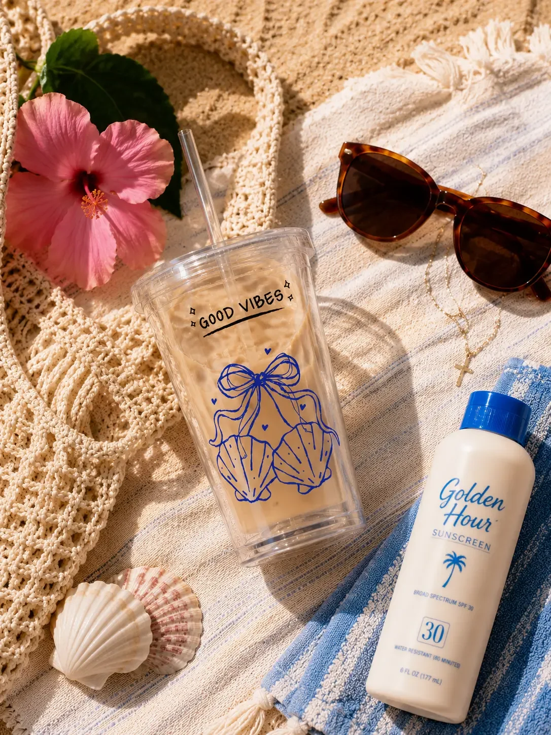 coastal-seashell-bow-iced-coffee-tumbler-beach-flatlay.webp