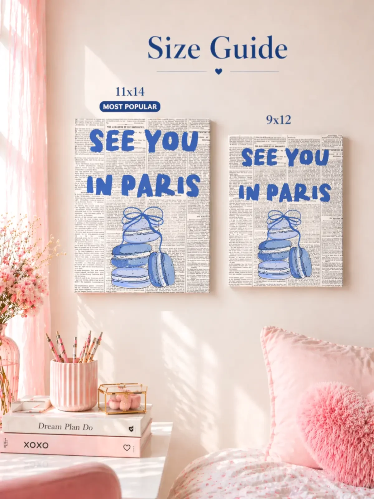 Size guide for Doodles and Saffron comparing 11x14 and 9x12 inch See You In Paris canvas prints hanging on a pastel pink wall.