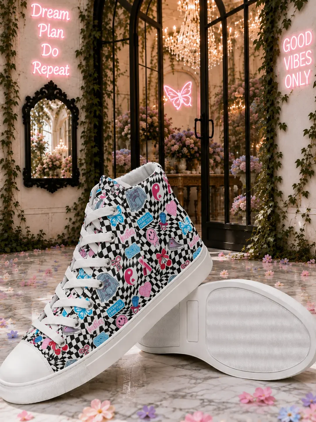 Pair of black and white checkered canvas high-top sneakers with colorful sticker graphics displayed on a marble garden floor.