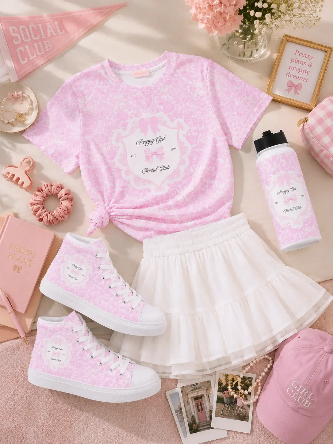 Flatlay of a pink Preppy Girl Social Club t-shirt, white ruffle skirt, pink high-top sneakers, and matching accessories.