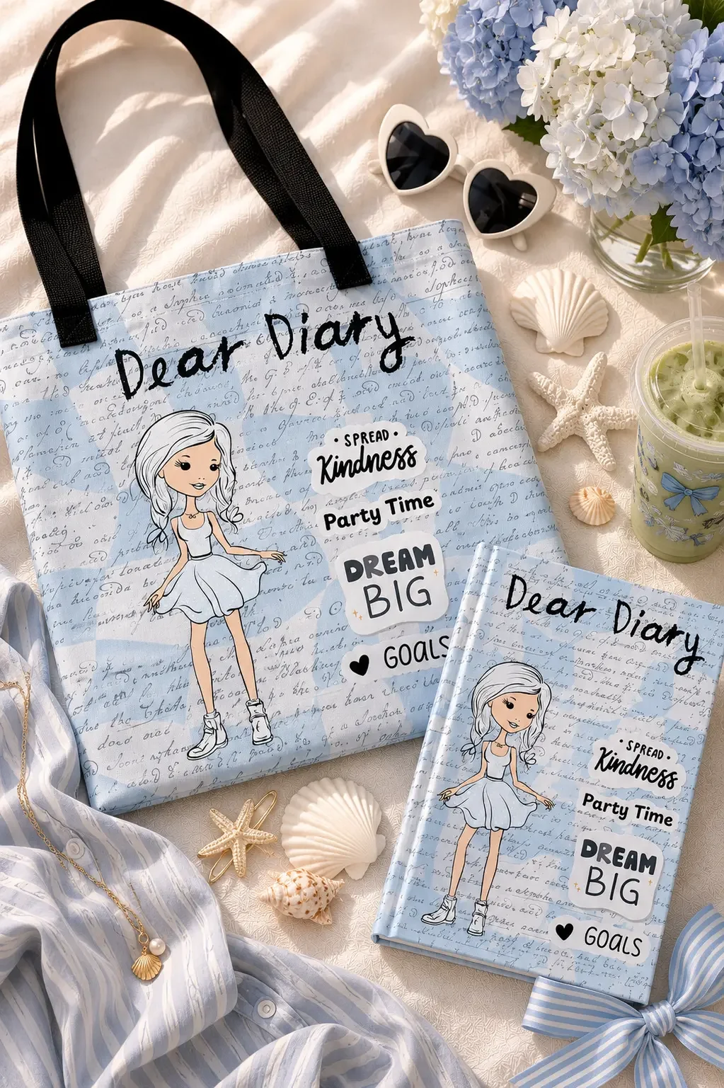 Close-up of a white tote bag with a script writing print pattern, a cartoon illustration, and text reading Dear Diary.