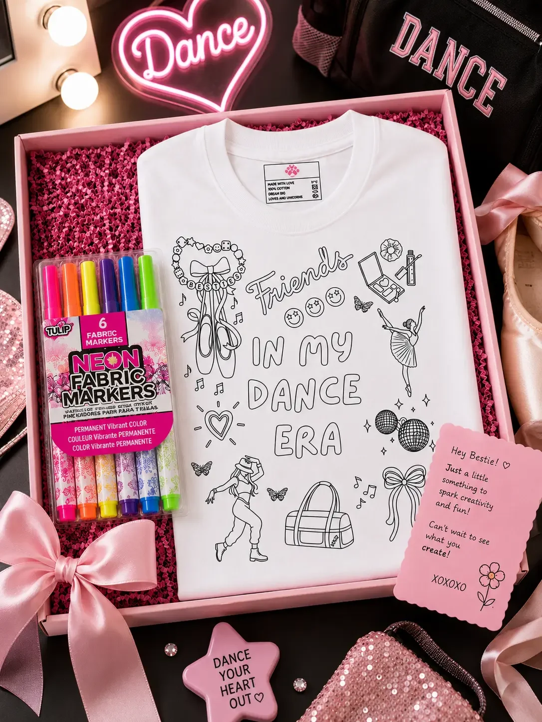 Open pink gift box featuring a white dance-themed coloring shirt, Tulip fabric markers, and a bestie note card.