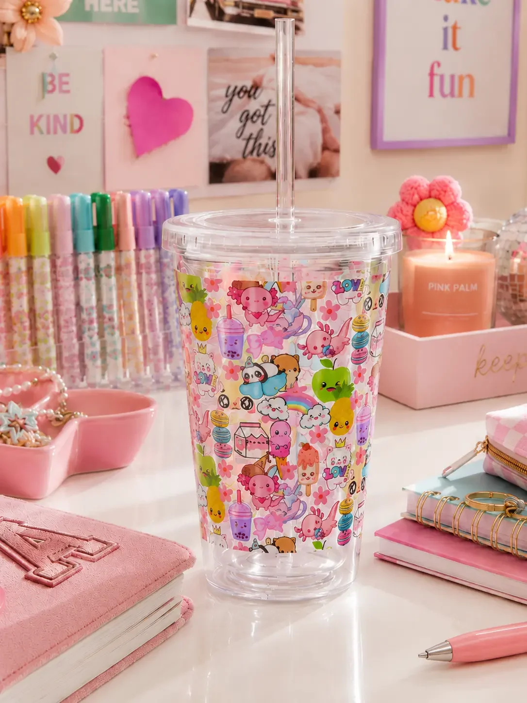Kawaii doodle carnival empty cup with a pastel pink desk with stationery and a candle.