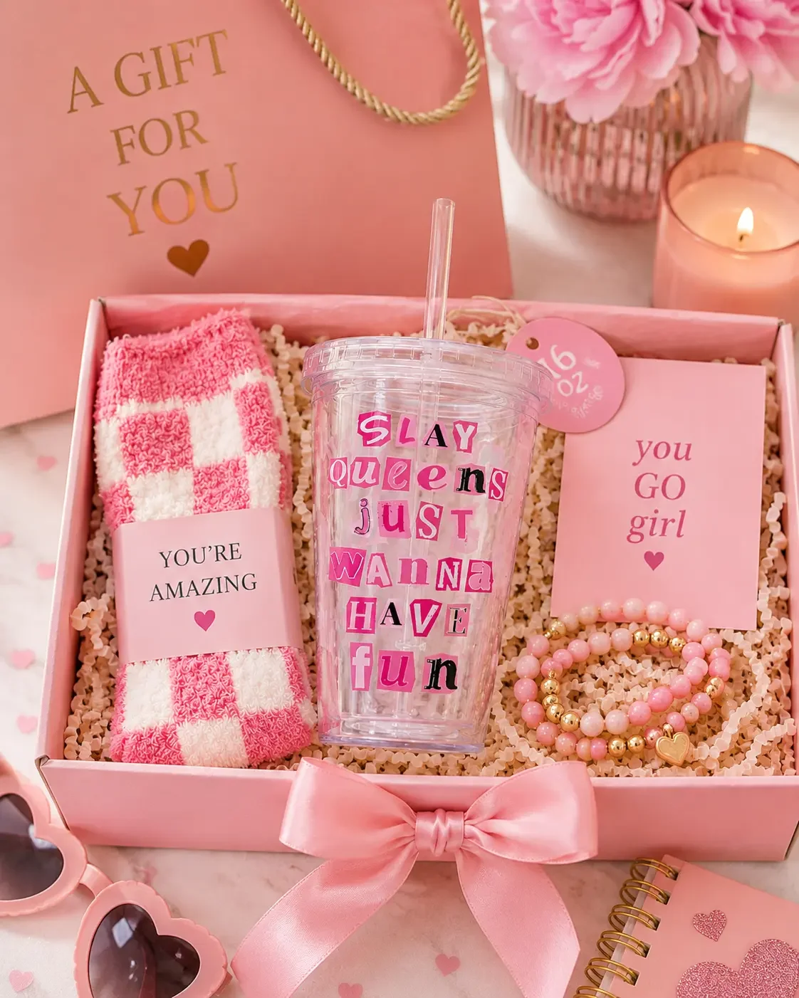 Preppy pink gift box with a "Slay Queens" tumbler cup, checkered socks, a bracelet, and a "you go girl" card.