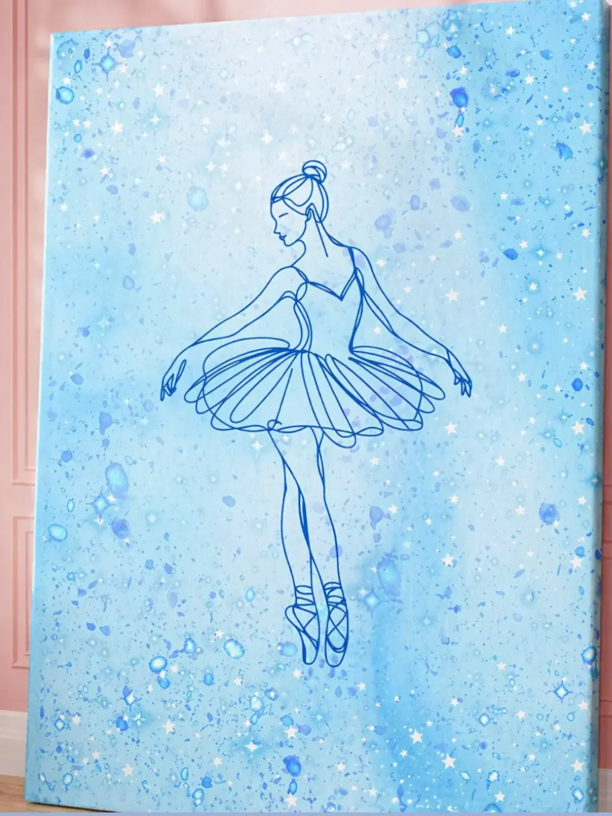 Close-up mockup of the Doodles and Saffron vertical blue ballerina canvas print showcasing design textures near a pink wall.